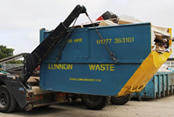 Skip Hire in Romford unloading a full skip