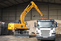Skip Hire in Romford unloading a lorry for transfer