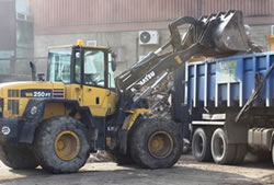 Skip Hire in Romford loading a lorry for transfer